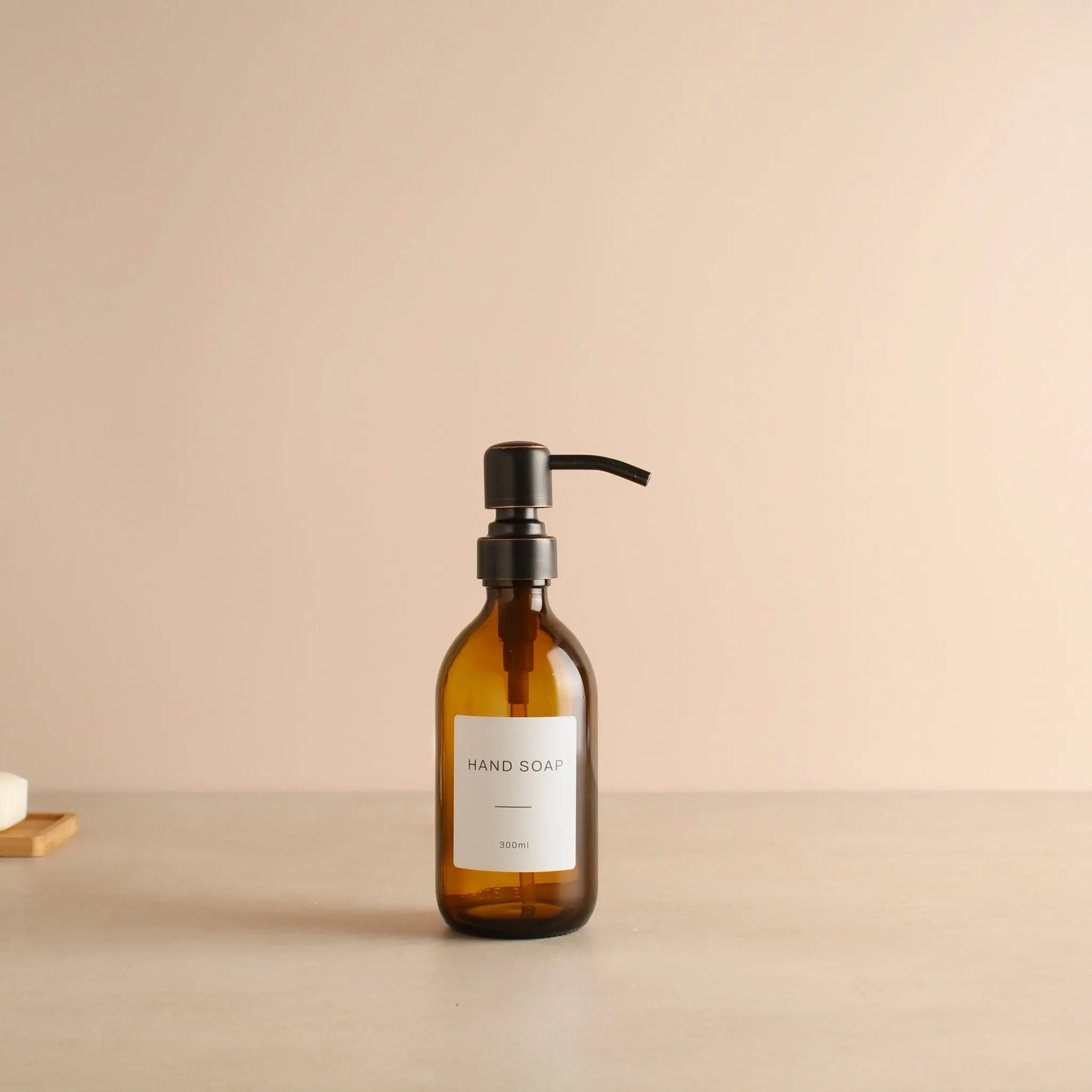 Labelled Amber Glass Dispenser Bottle With Black/Copper Pump - Image 5