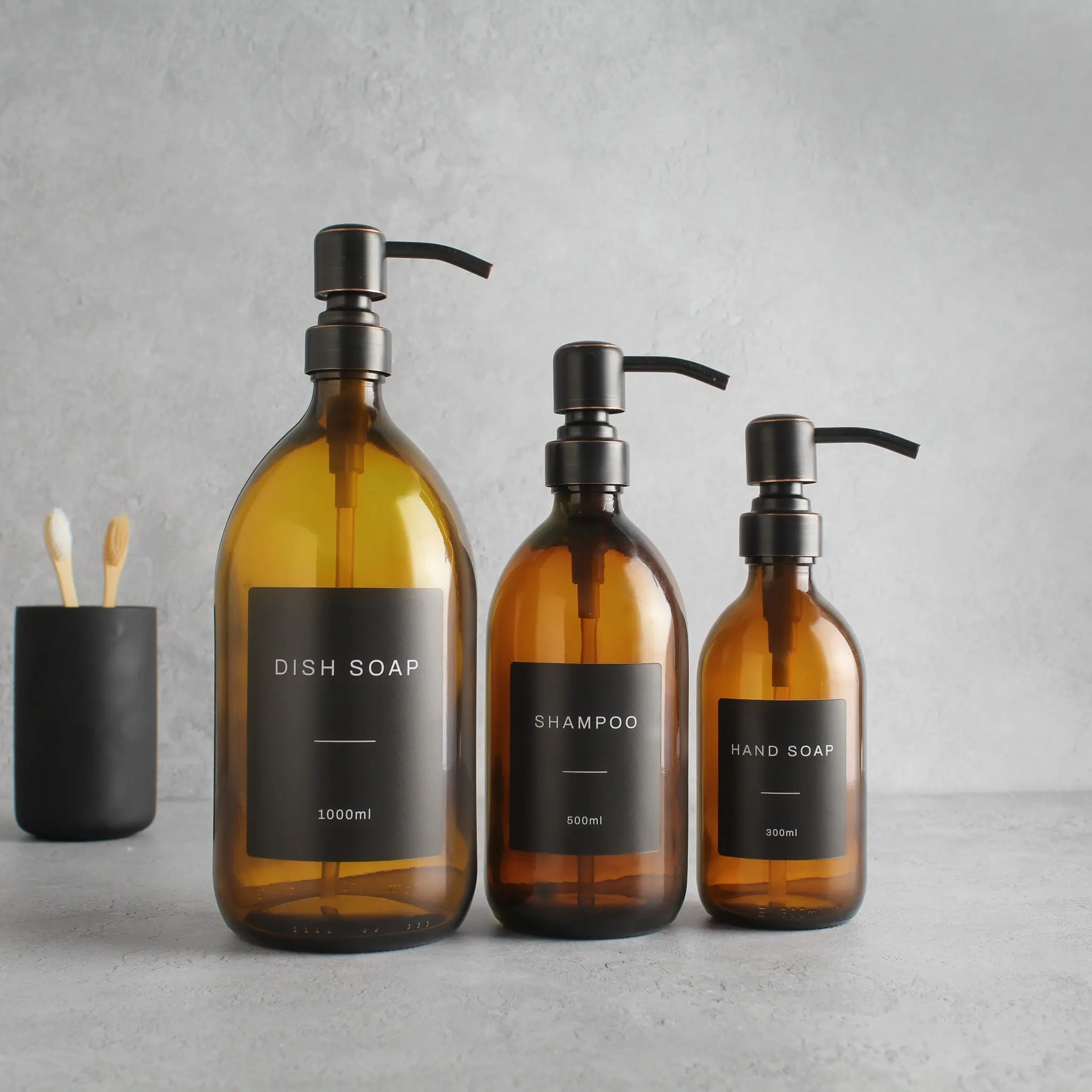 Labelled Amber Glass Dispenser Bottle With Black/Copper Pump - Image 2