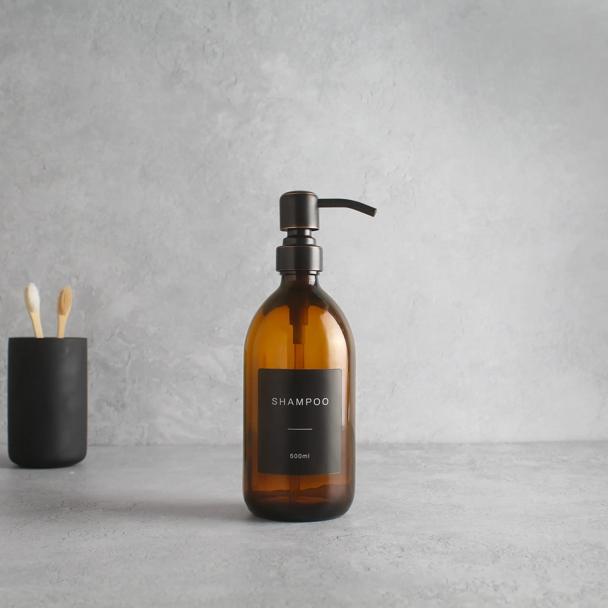 Labelled Amber Glass Dispenser Bottle With Black/Copper Pump - Image 4