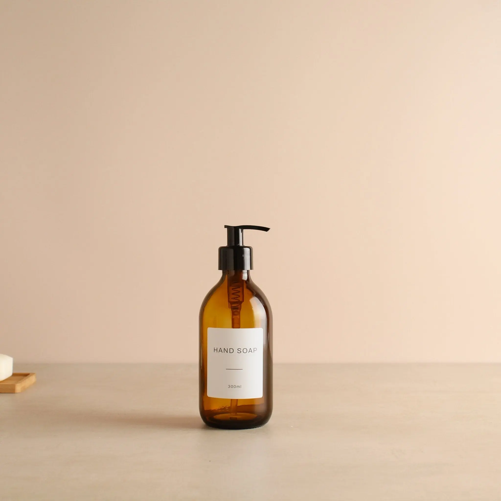 Labelled Amber Glass Dispenser Bottle With Black Pump - Image 5