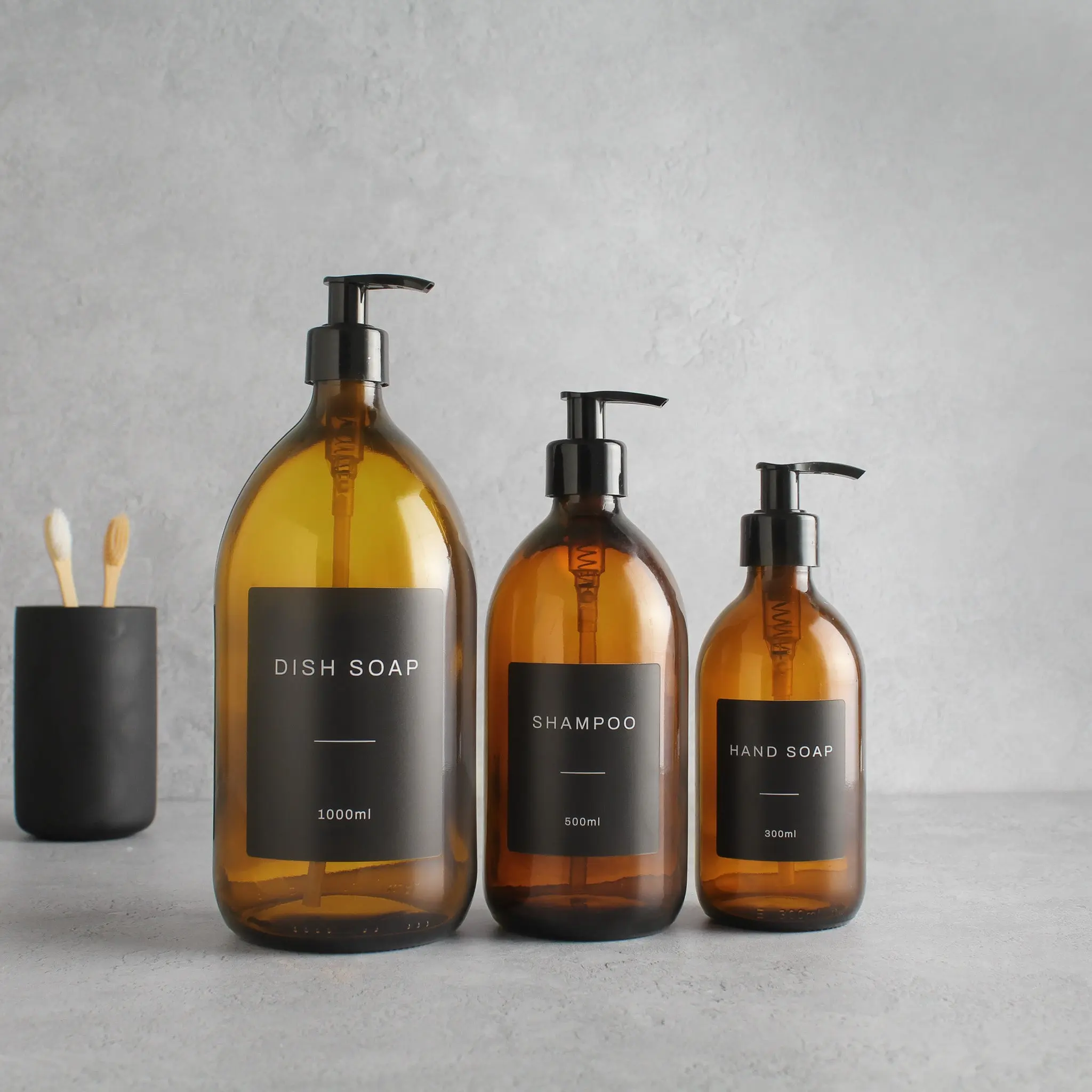 Labelled Amber Glass Dispenser Bottle With Black Pump - Image 2
