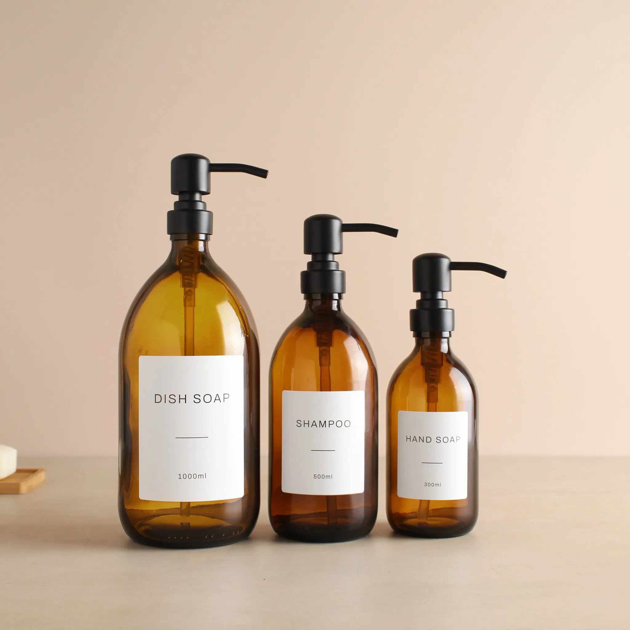 Labelled Amber Glass Dispenser Bottle With Matte Black Pump - Image 2