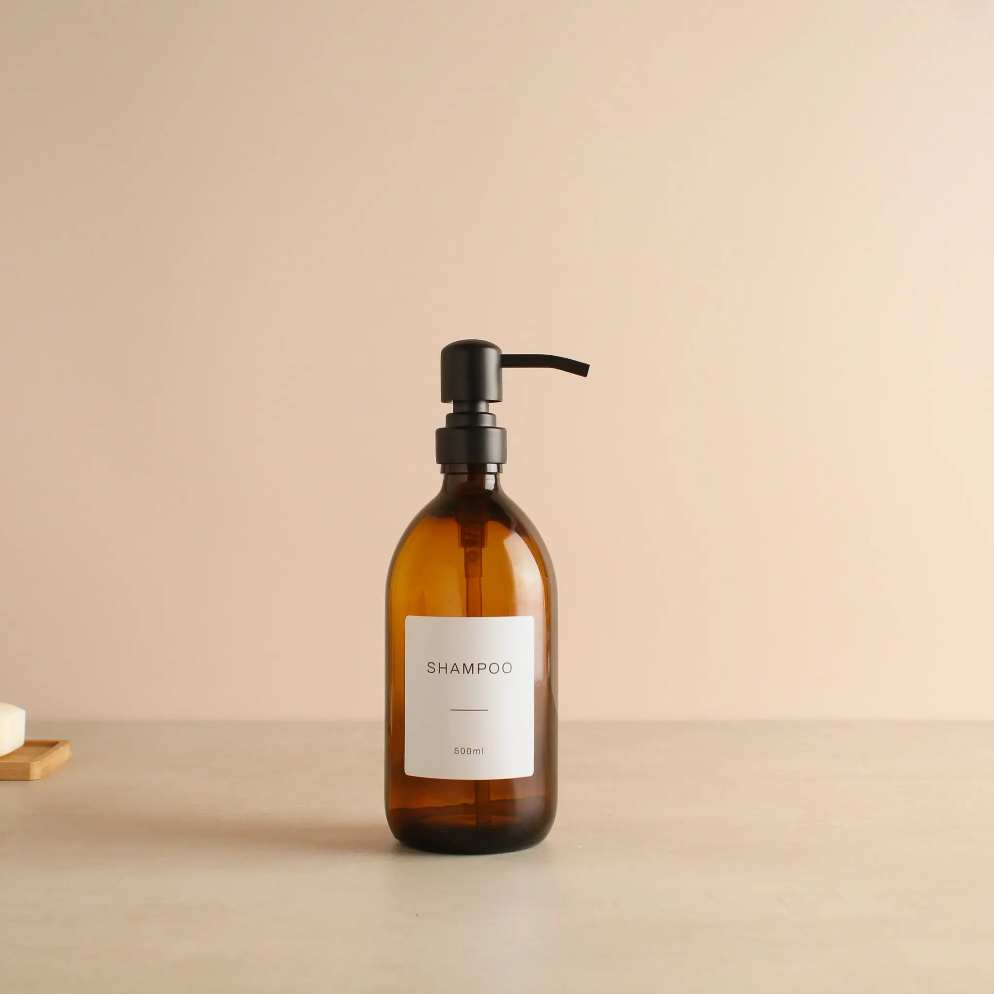 Labelled Amber Glass Dispenser Bottle With Matte Black Pump - Image 4