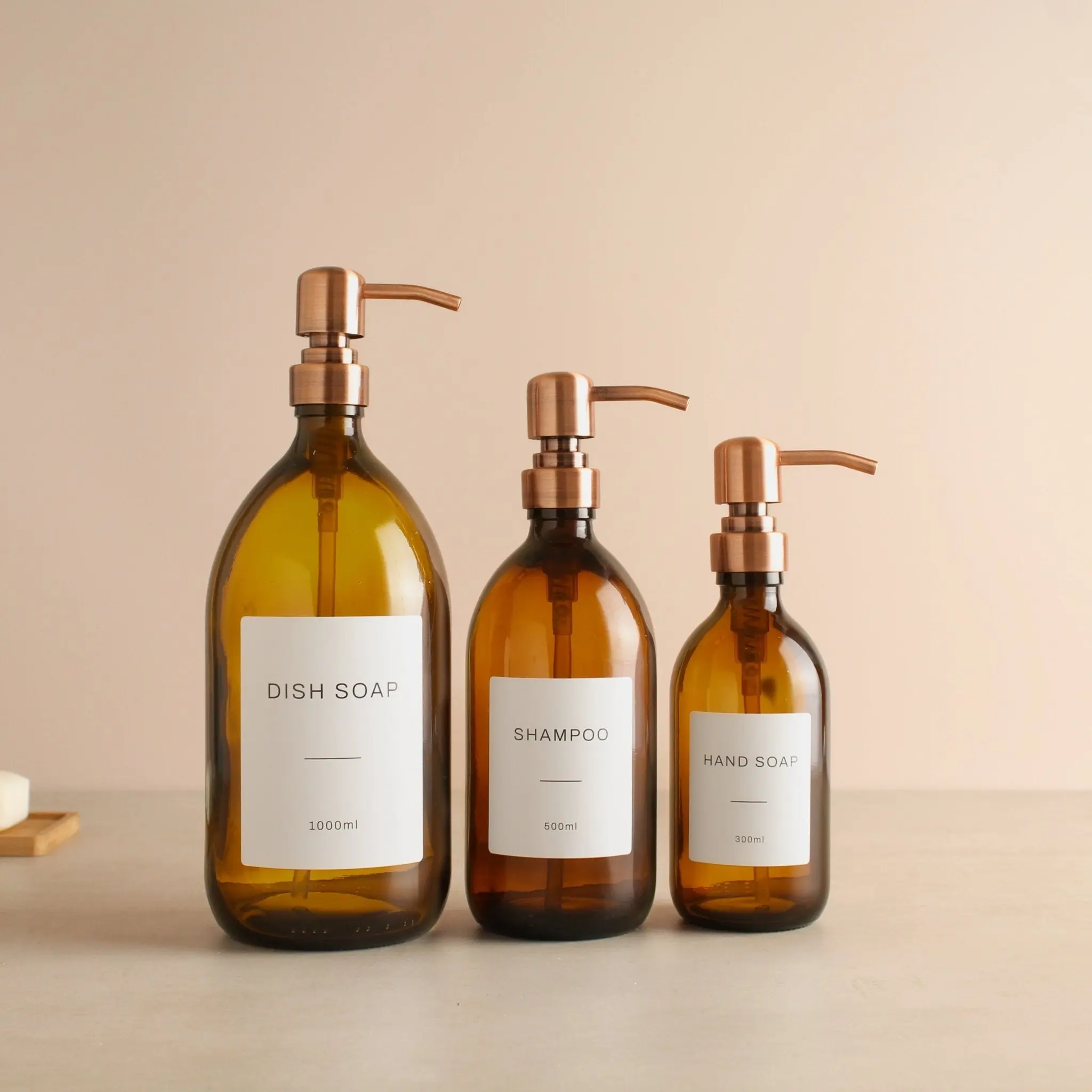 Labelled Amber Glass Dispenser Bottle With Rose Gold Pump - Image 2