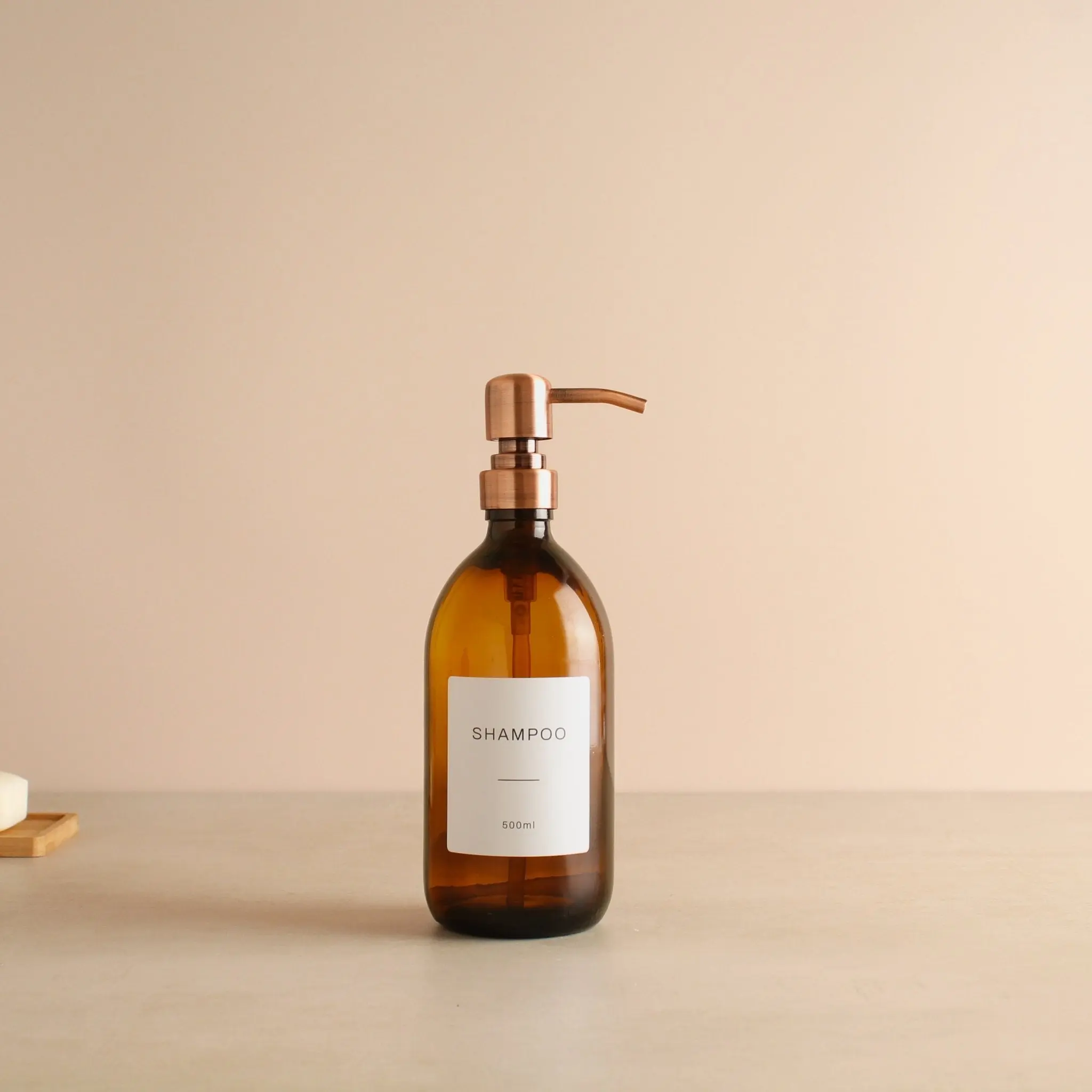 Labelled Amber Glass Dispenser Bottle With Rose Gold Pump - Image 4