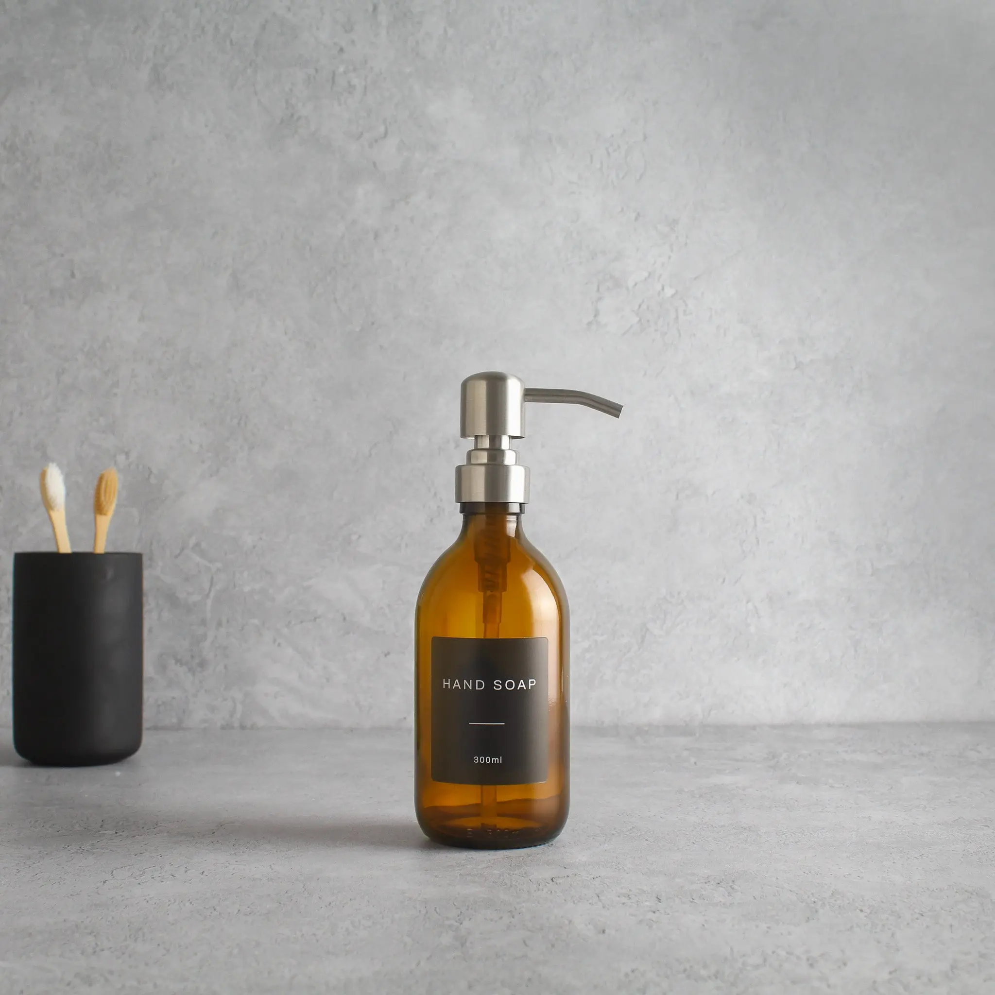 Labelled Amber Glass Dispenser Bottle With Silver Pump - Image 5