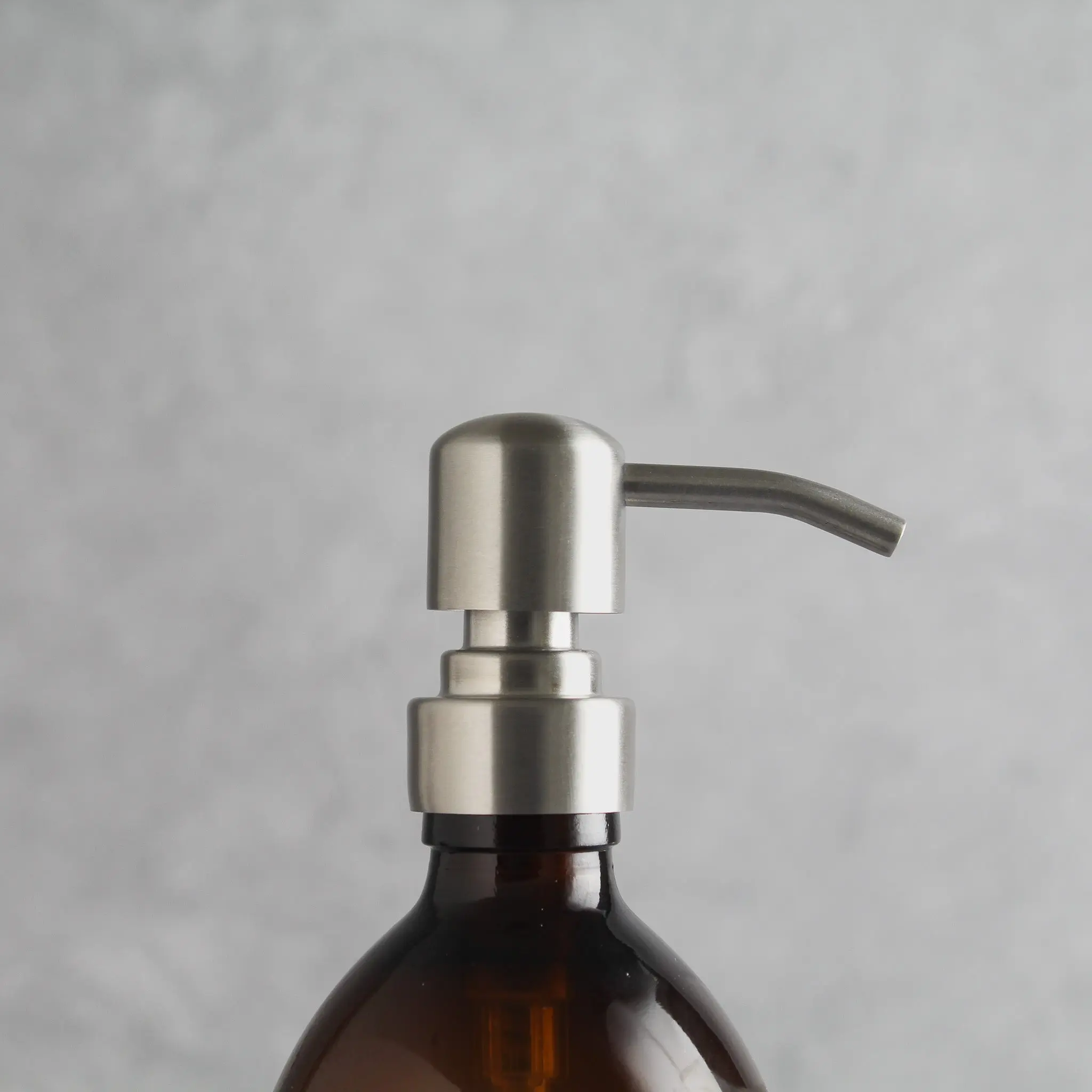 Labelled Amber Glass Dispenser Bottle With Silver Pump - Image 6