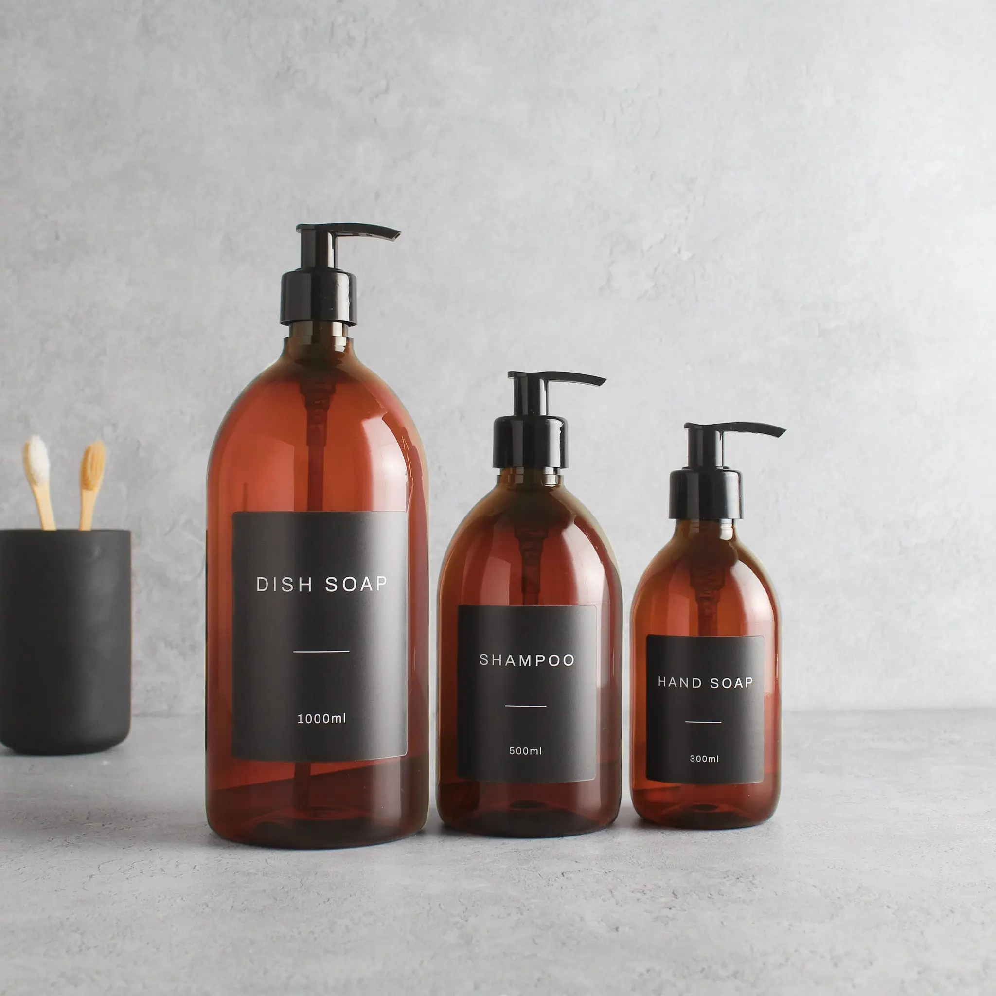 Labelled Amber Plastic Dispenser Bottle With Black Pump - Image 2