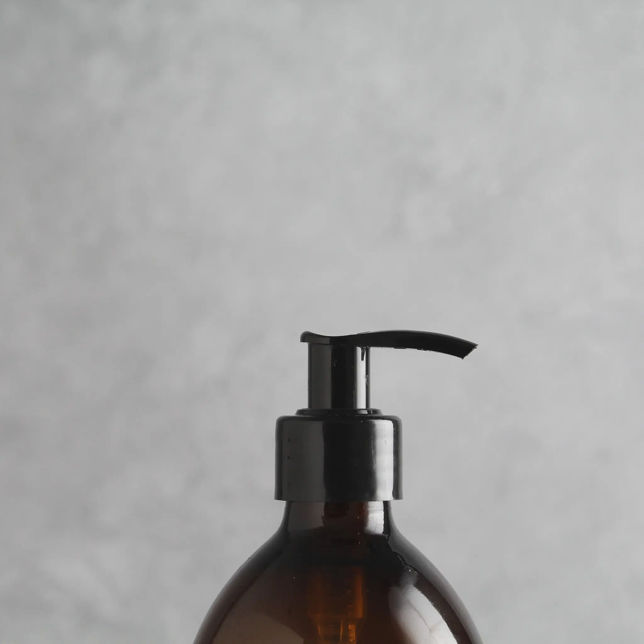 Labelled Amber Plastic Dispenser Bottle With Black Pump - Image 6