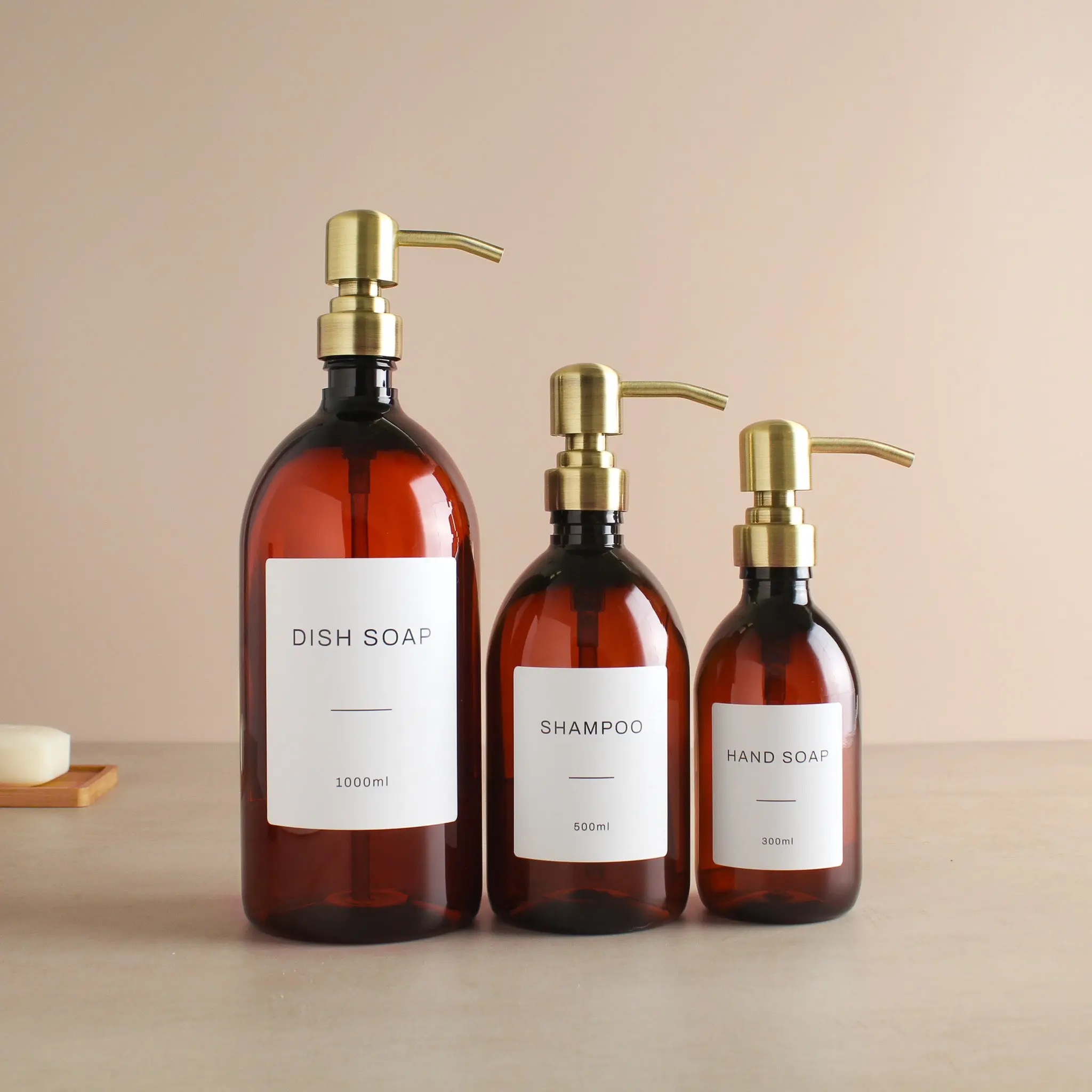 Labelled Amber Plastic Dispenser Bottle With Gold Pump - Image 2