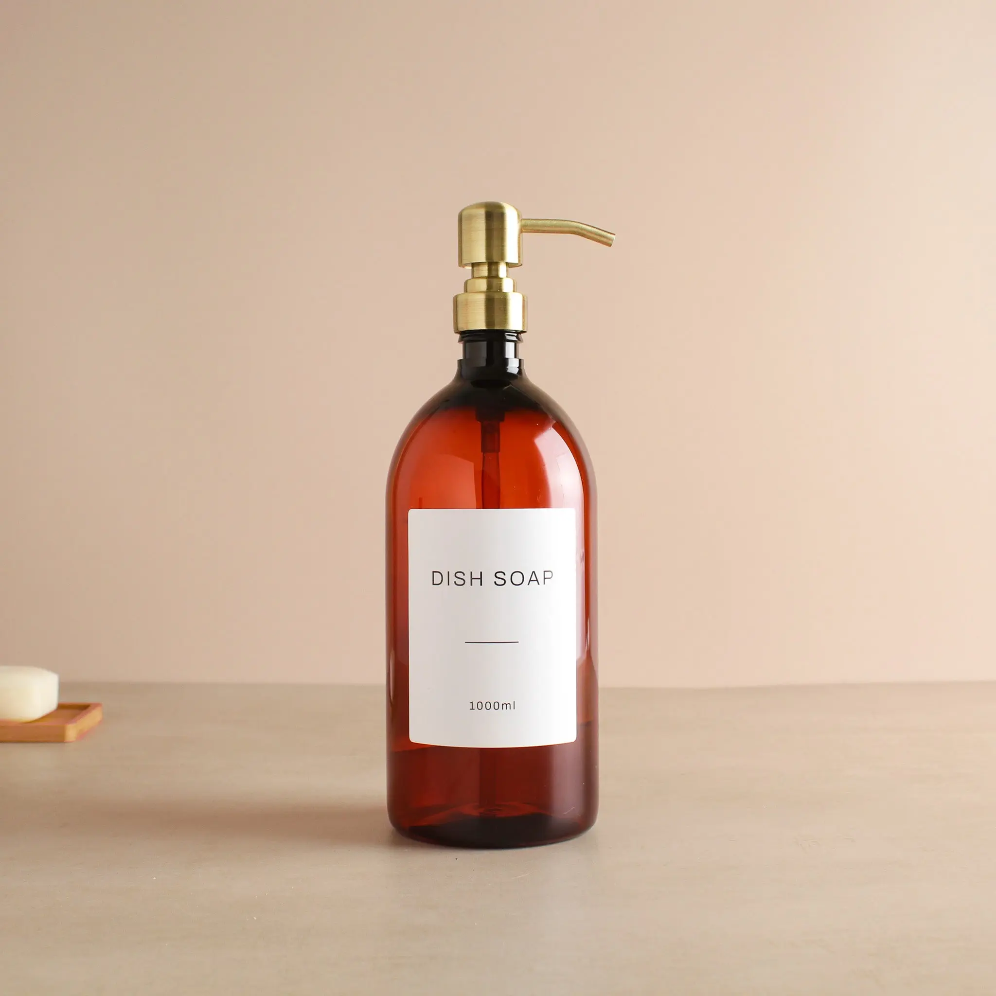 Labelled Amber Plastic Dispenser Bottle With Gold Pump - Image 3