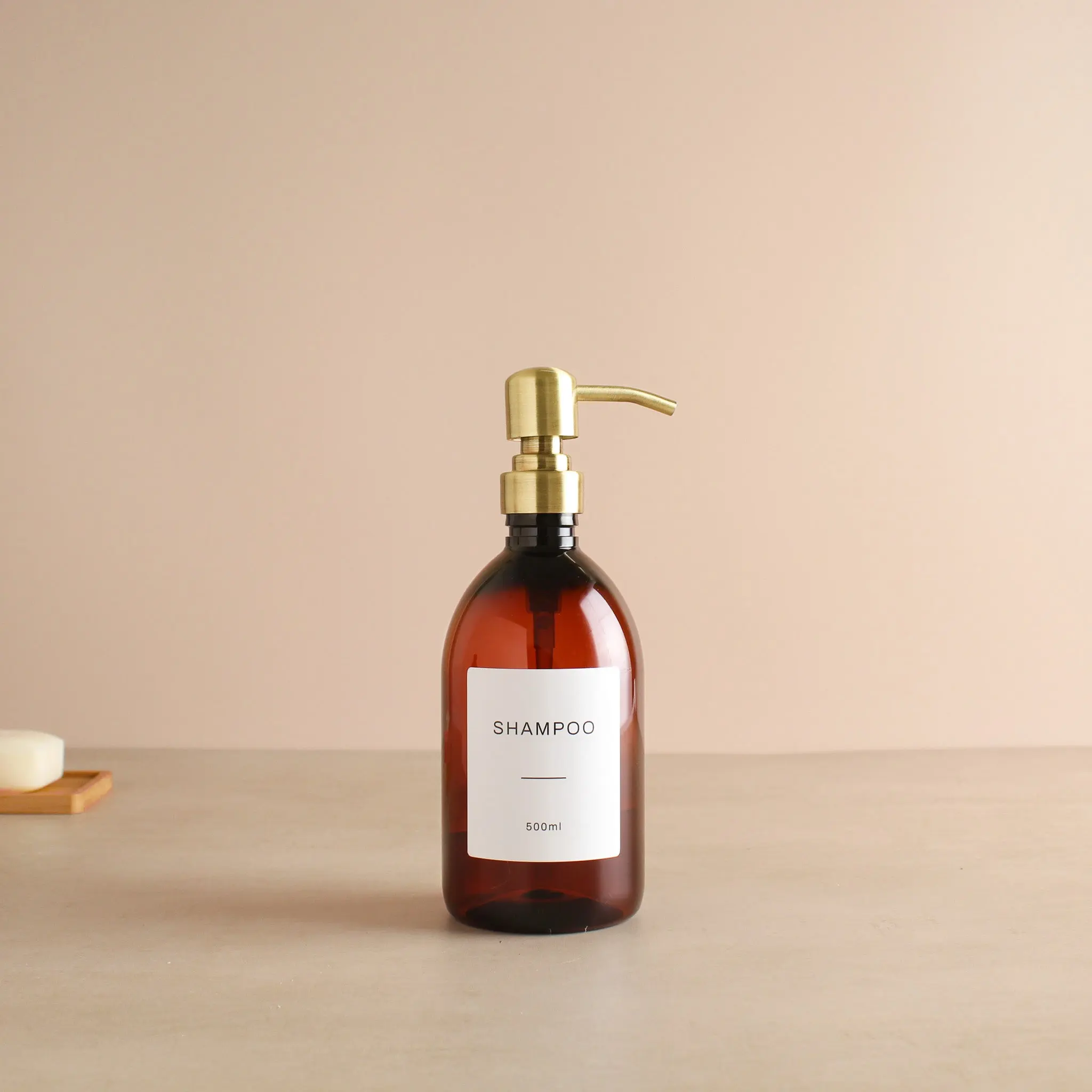 Labelled Amber Plastic Dispenser Bottle With Gold Pump - Image 4