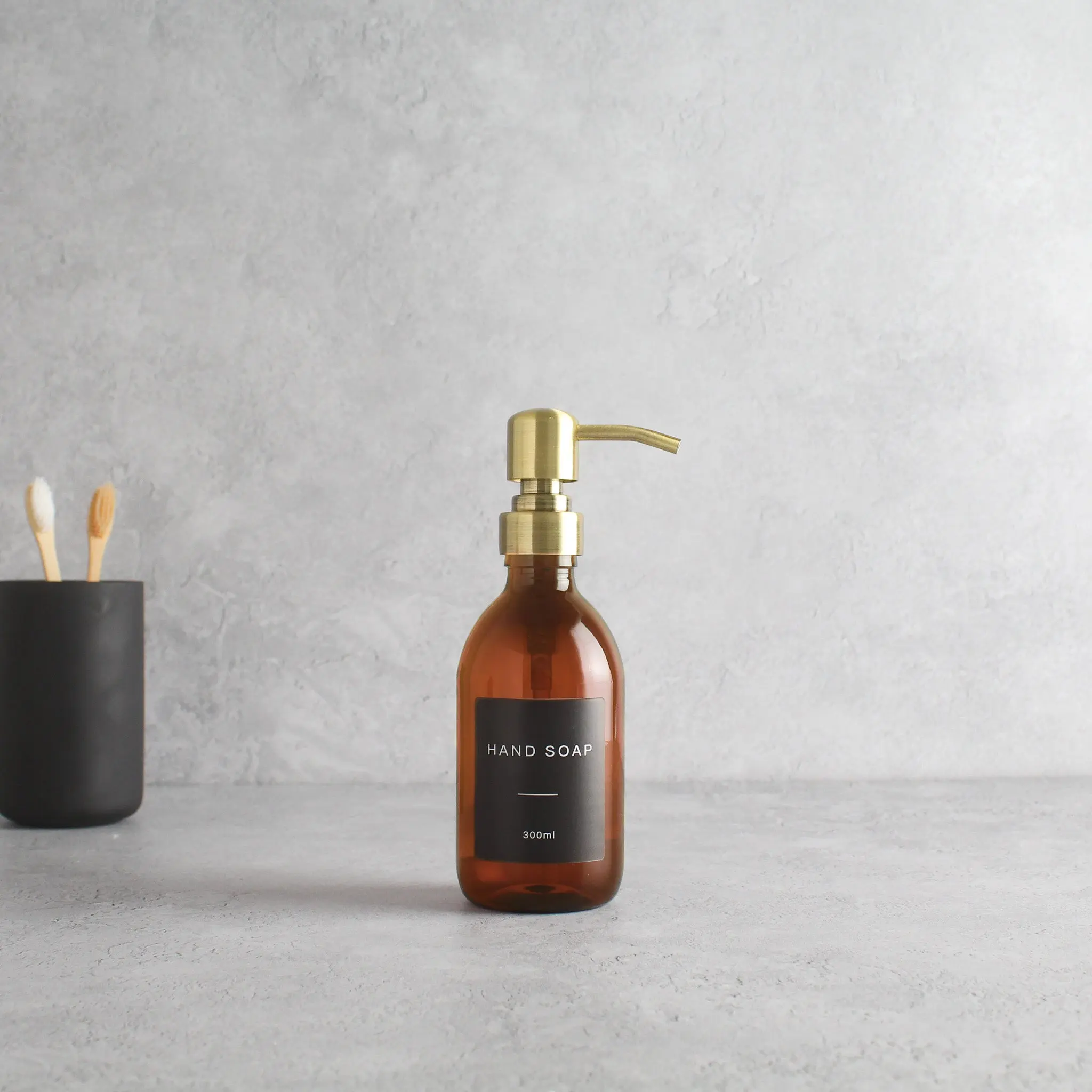 Labelled Amber Plastic Dispenser Bottle With Gold Pump - Image 5