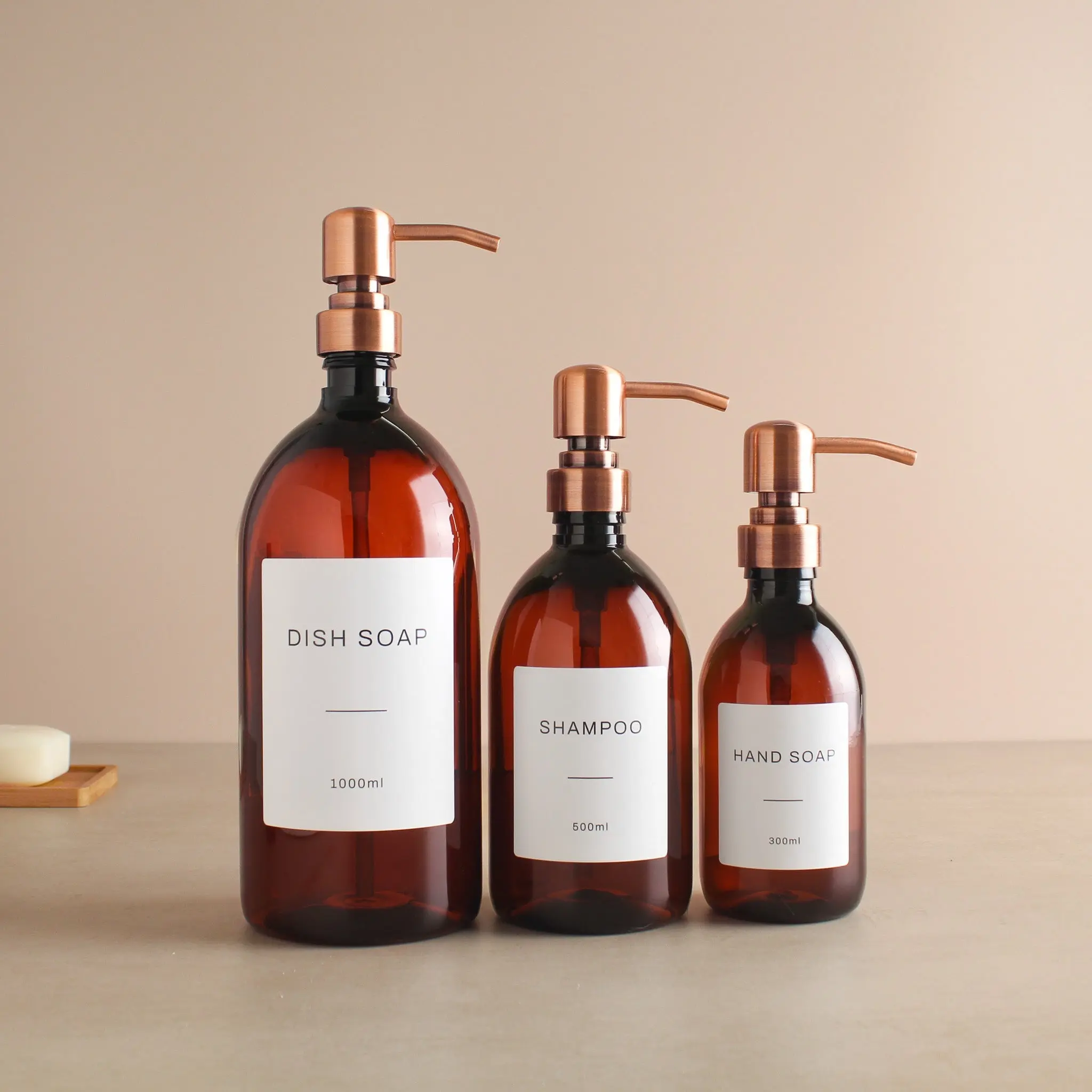 Labelled Amber Plastic Dispenser Bottle With Rose Gold Pump - Image 2