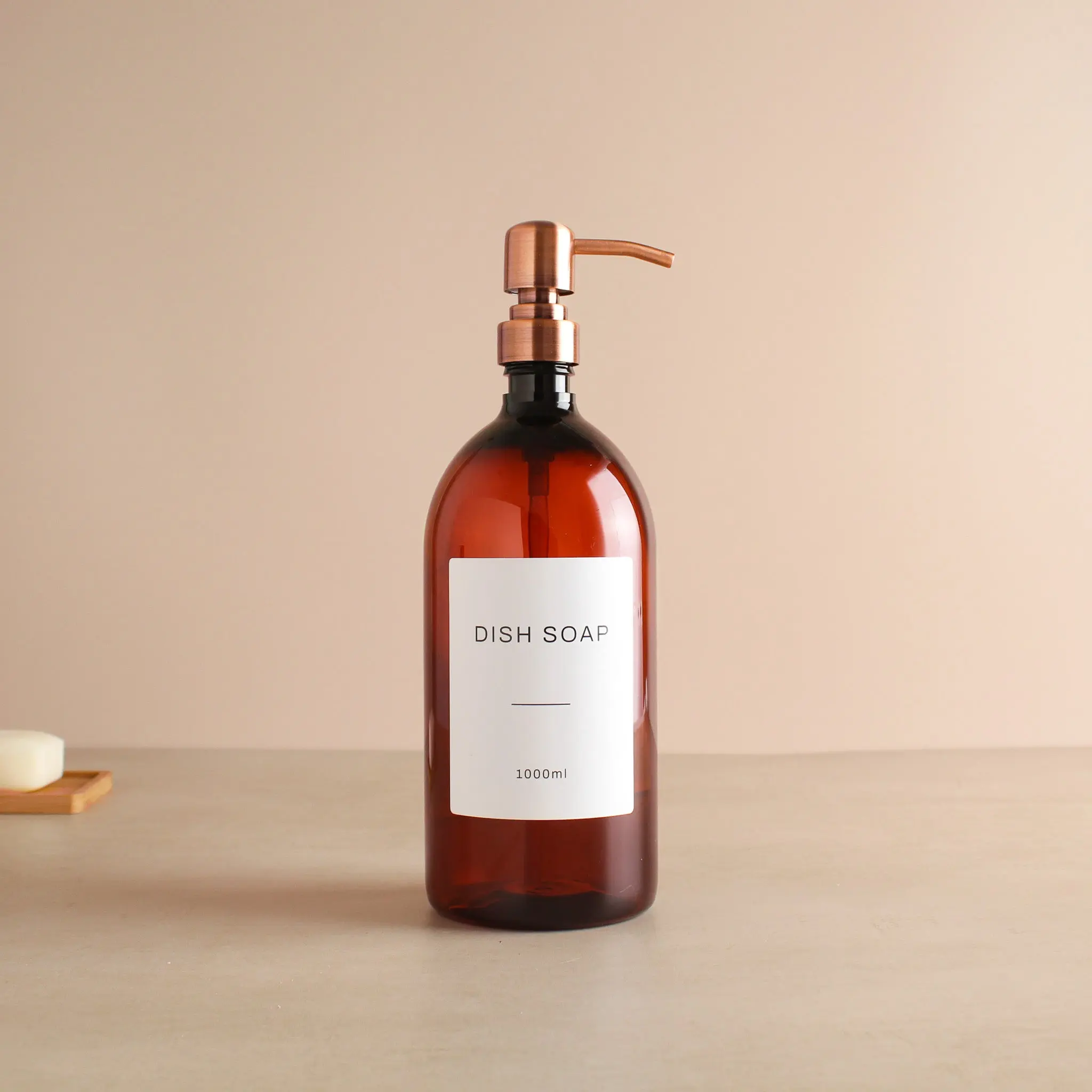 Labelled Amber Plastic Dispenser Bottle With Rose Gold Pump - Image 3