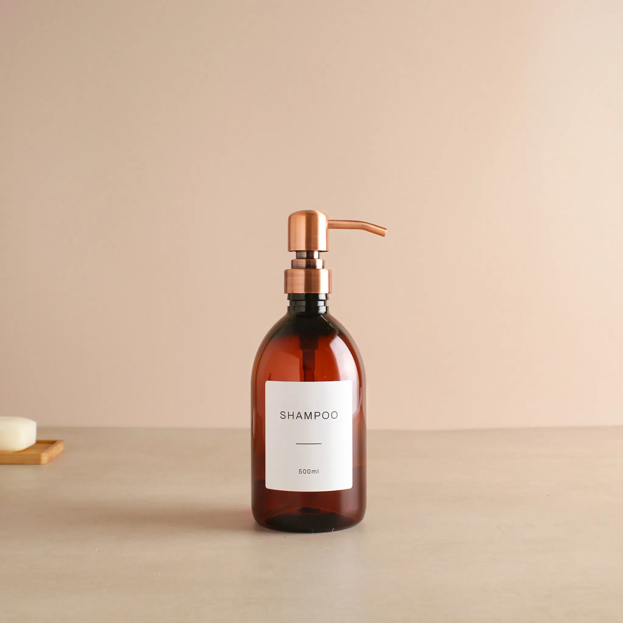 Labelled Amber Plastic Dispenser Bottle With Rose Gold Pump - Image 4
