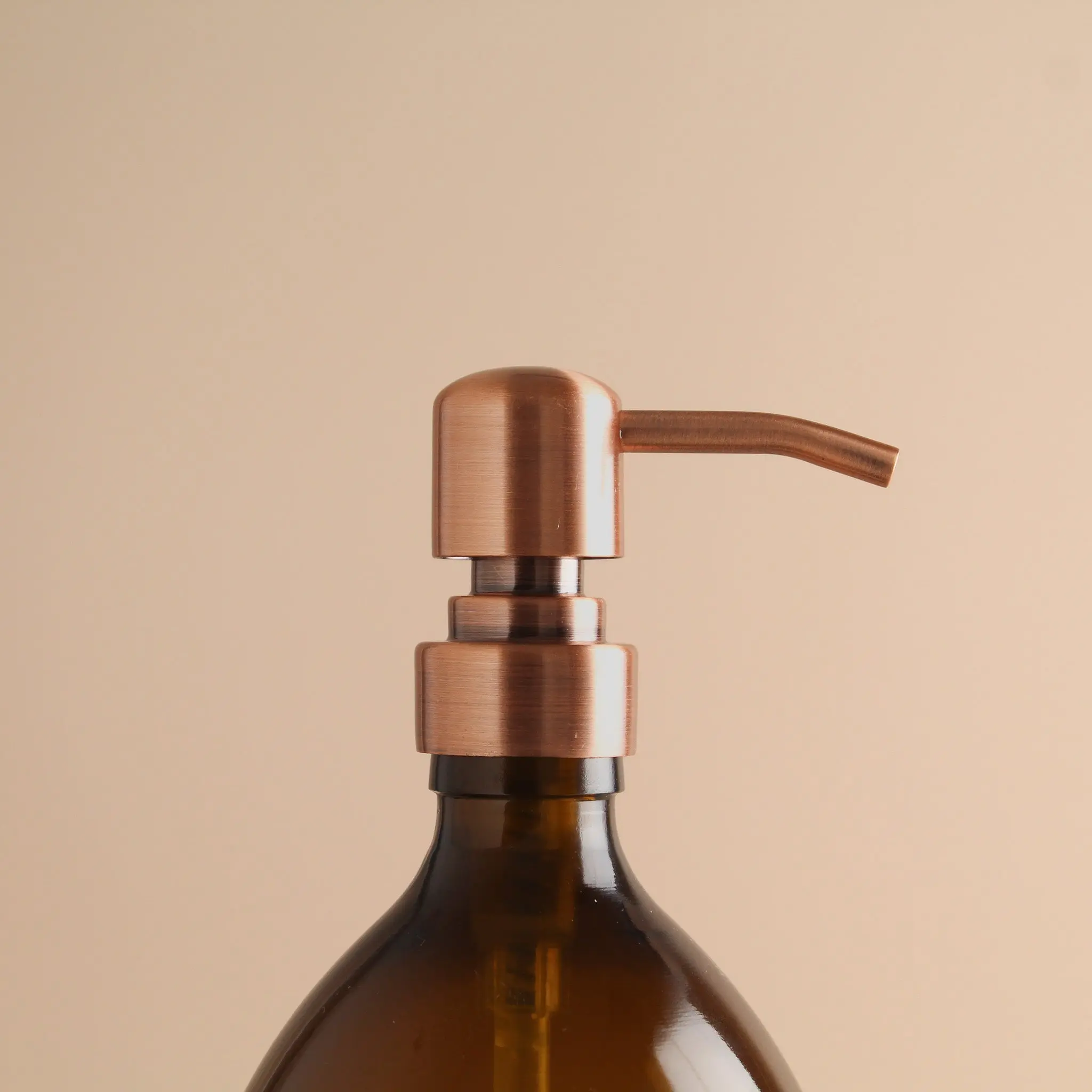 Labelled Amber Plastic Dispenser Bottle With Rose Gold Pump - Image 6