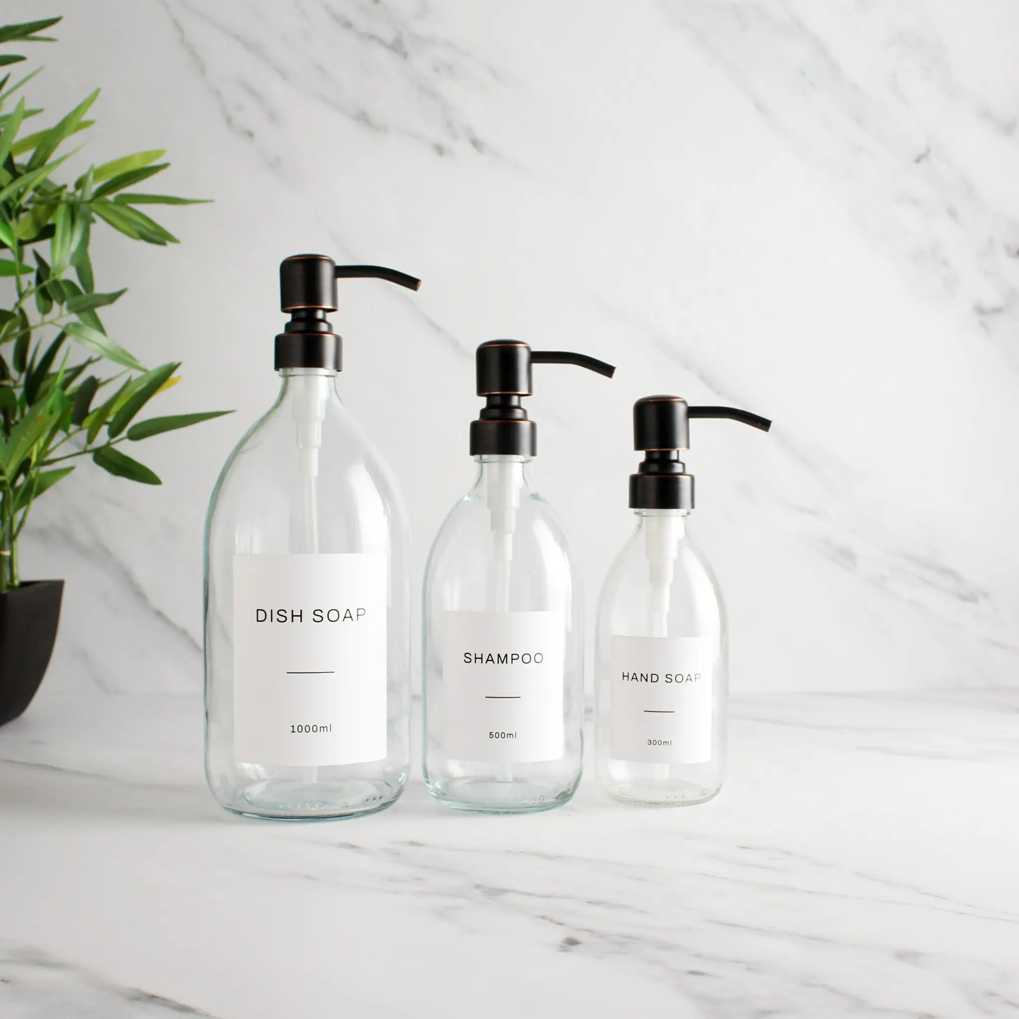 Labelled Clear Glass Dispenser Bottle With Black/Copper Pump - Image 2