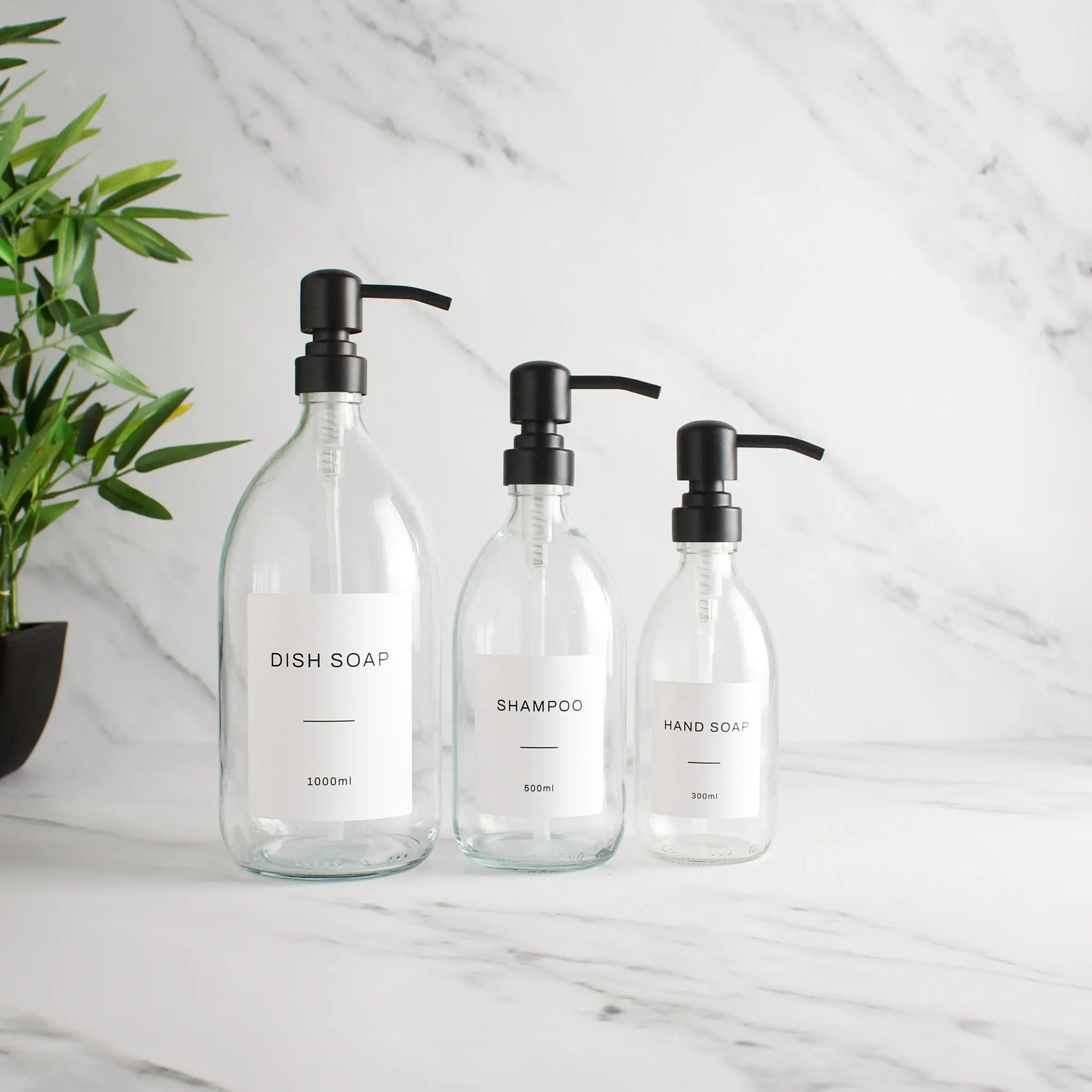 Labelled Clear Glass Dispenser Bottle With Matte Black Pump - Image 2
