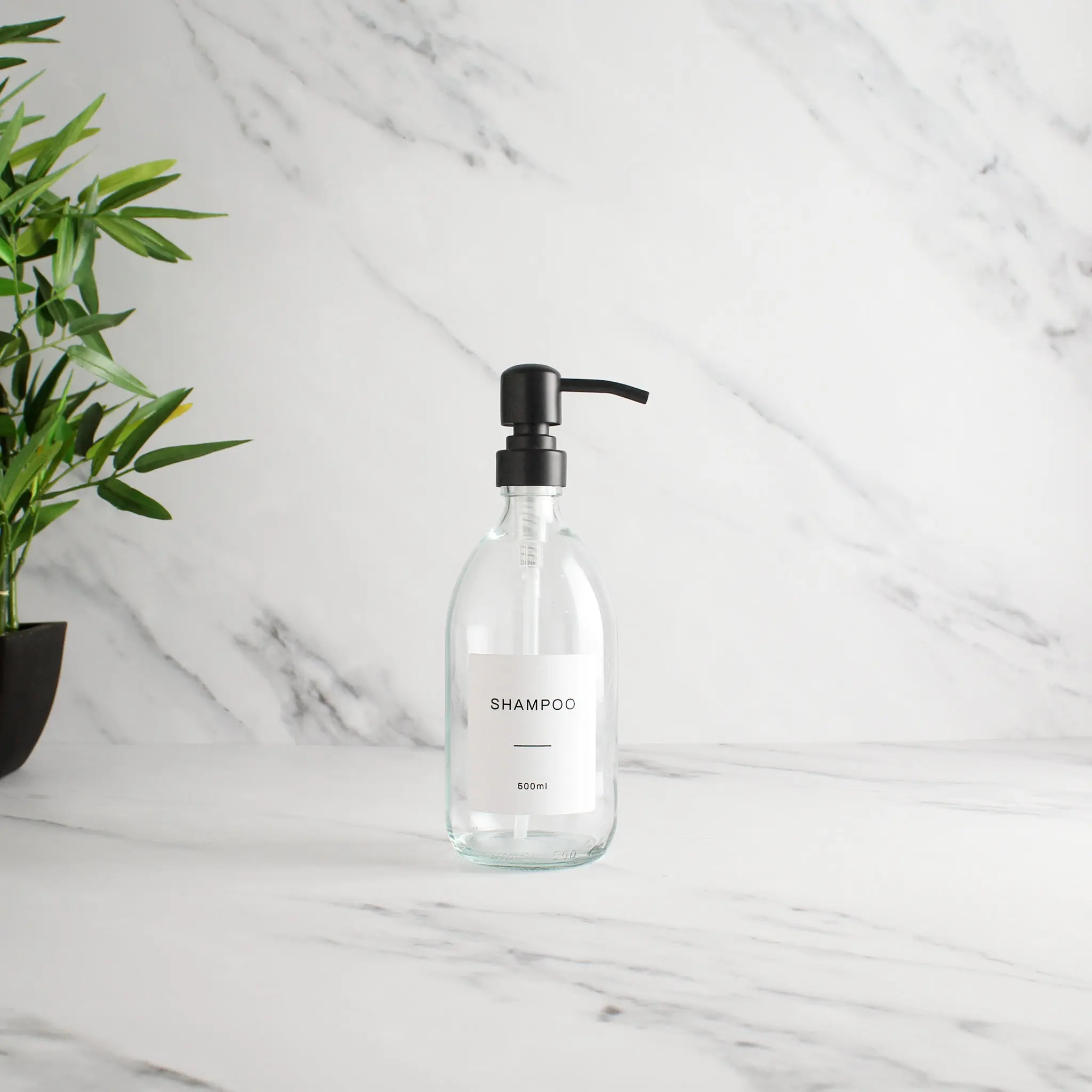 Labelled Clear Glass Dispenser Bottle With Matte Black Pump - Image 4