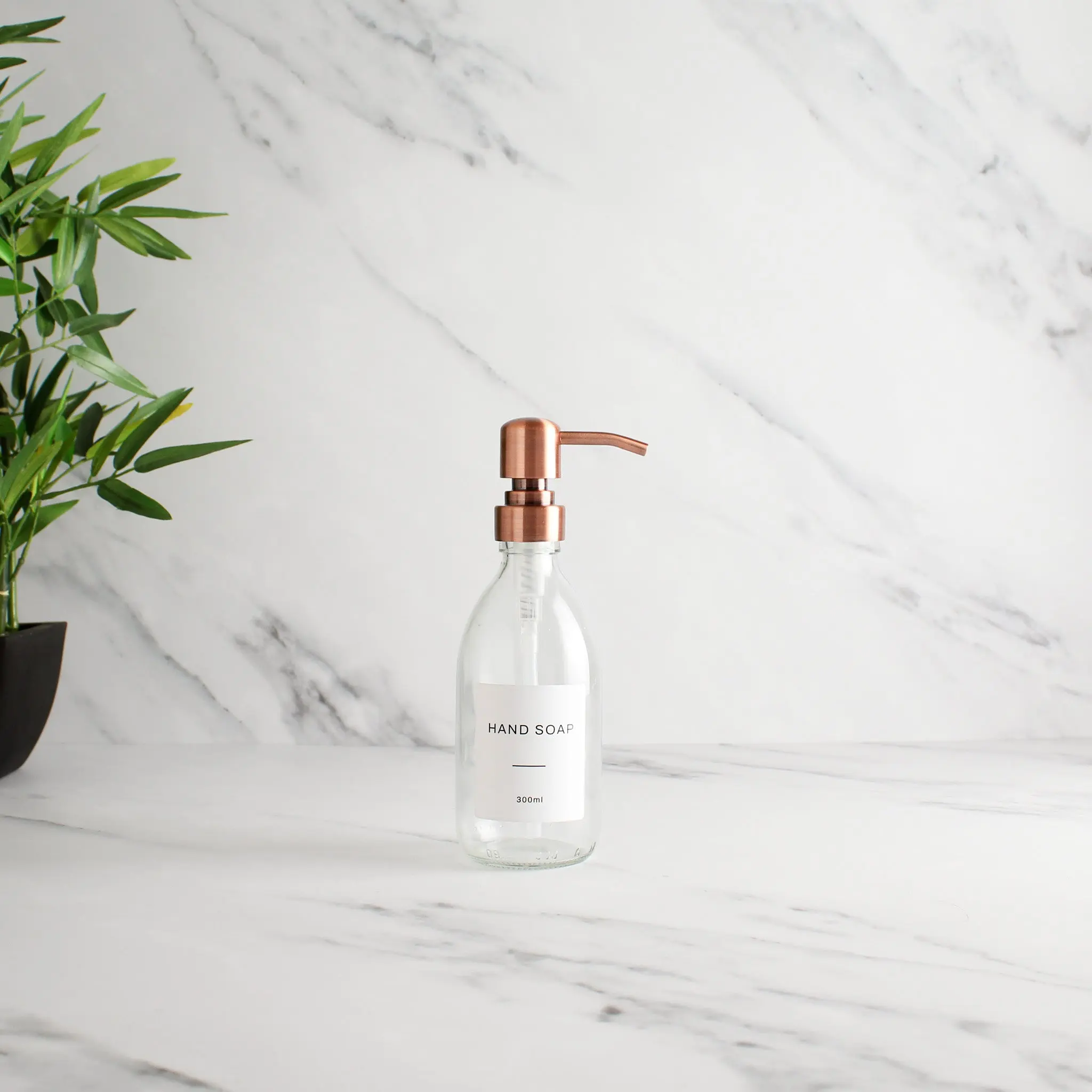 Labelled Clear Glass Dispenser Bottle With Rose Gold Pump - Image 5