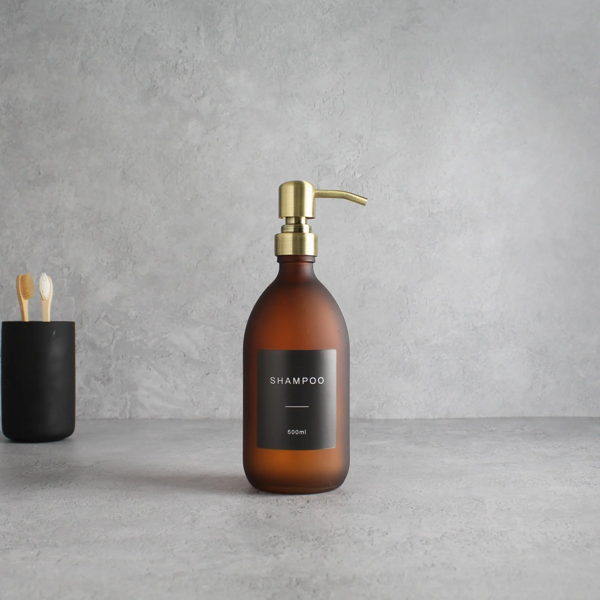 Labelled Frosted Amber Glass Dispenser Bottle With Gold Pump - Image 4