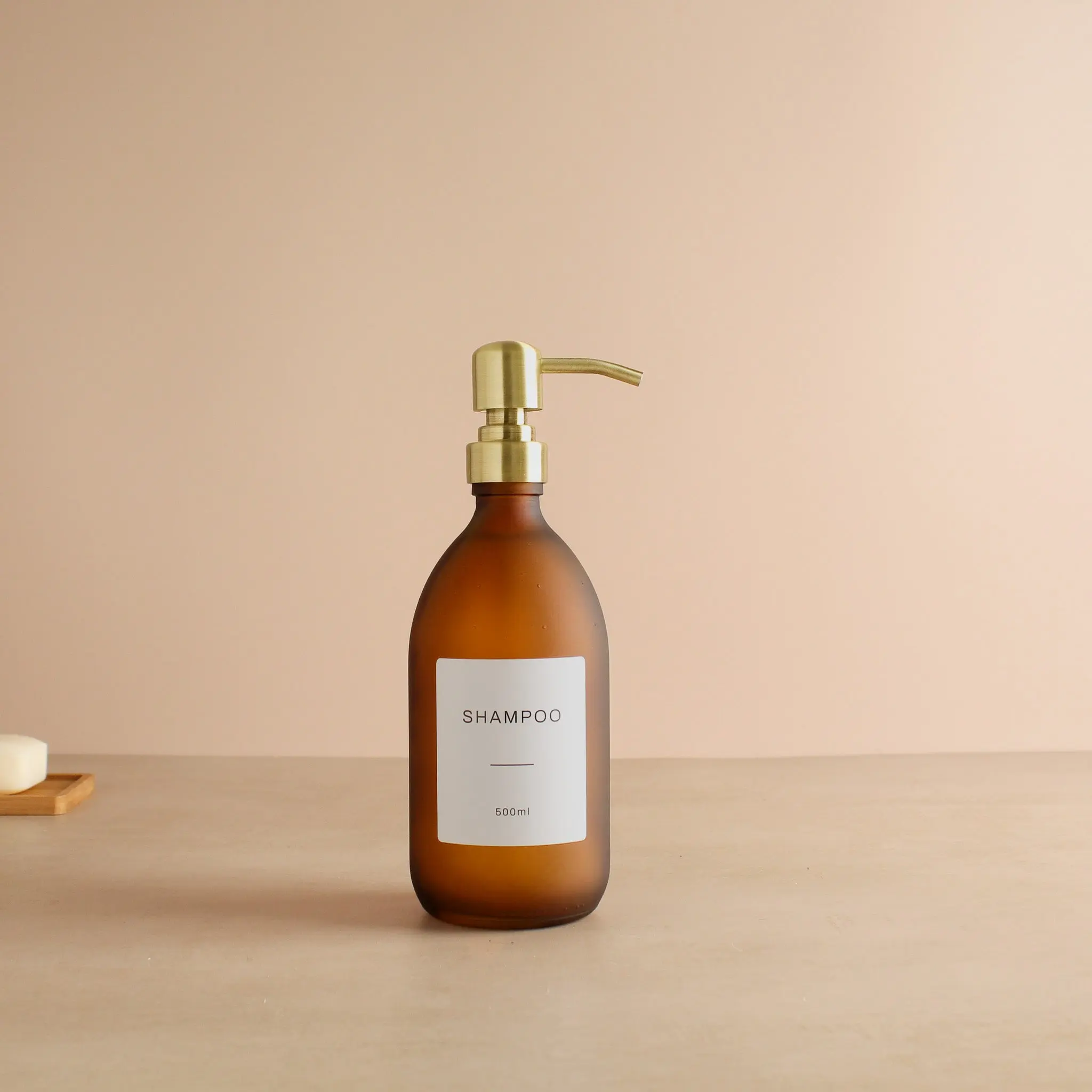 Labelled Frosted Amber Glass Dispenser Bottle With Gold Pump - Image 4