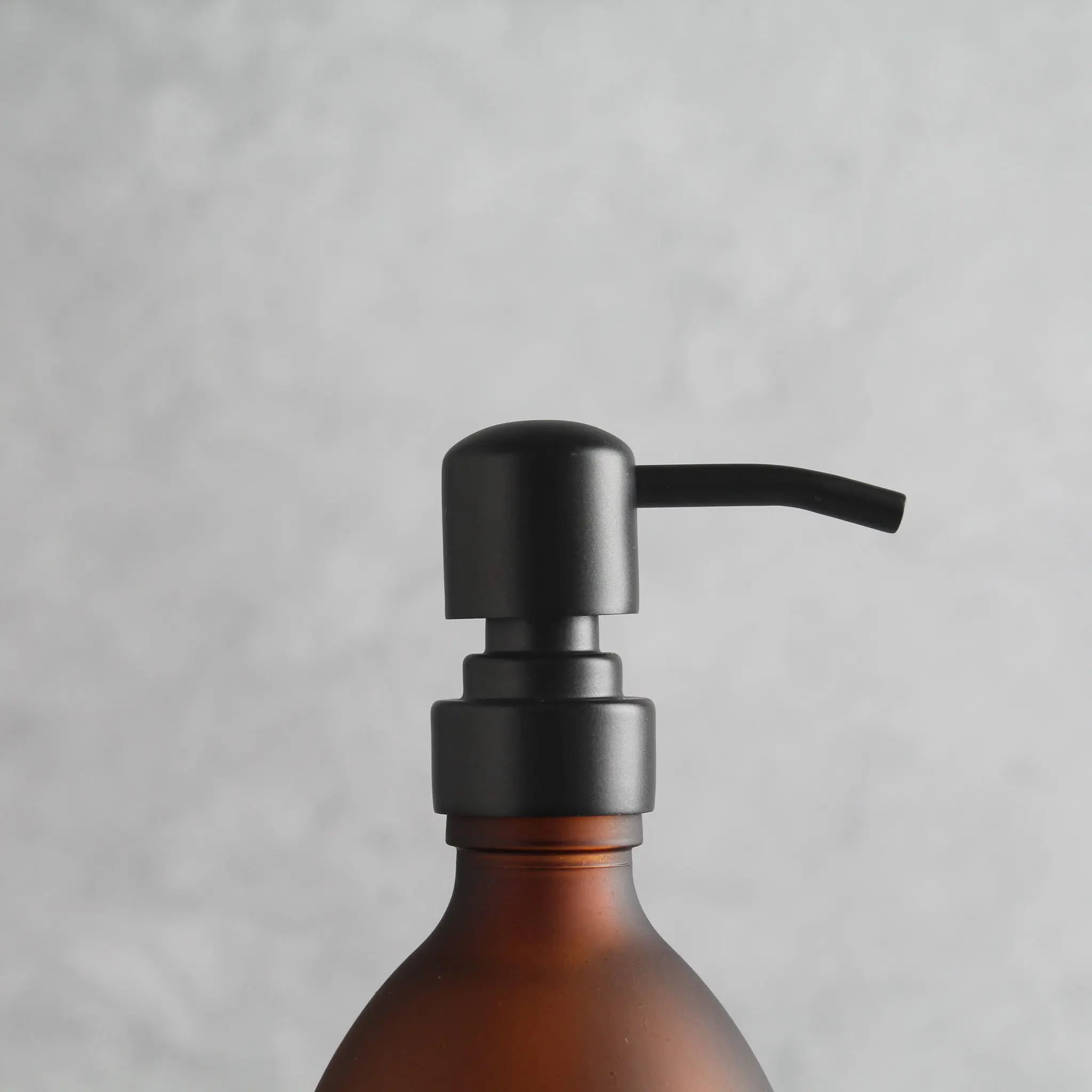 Labelled Frosted Amber Glass Dispenser Bottle With Matte Black Pump - Image 6