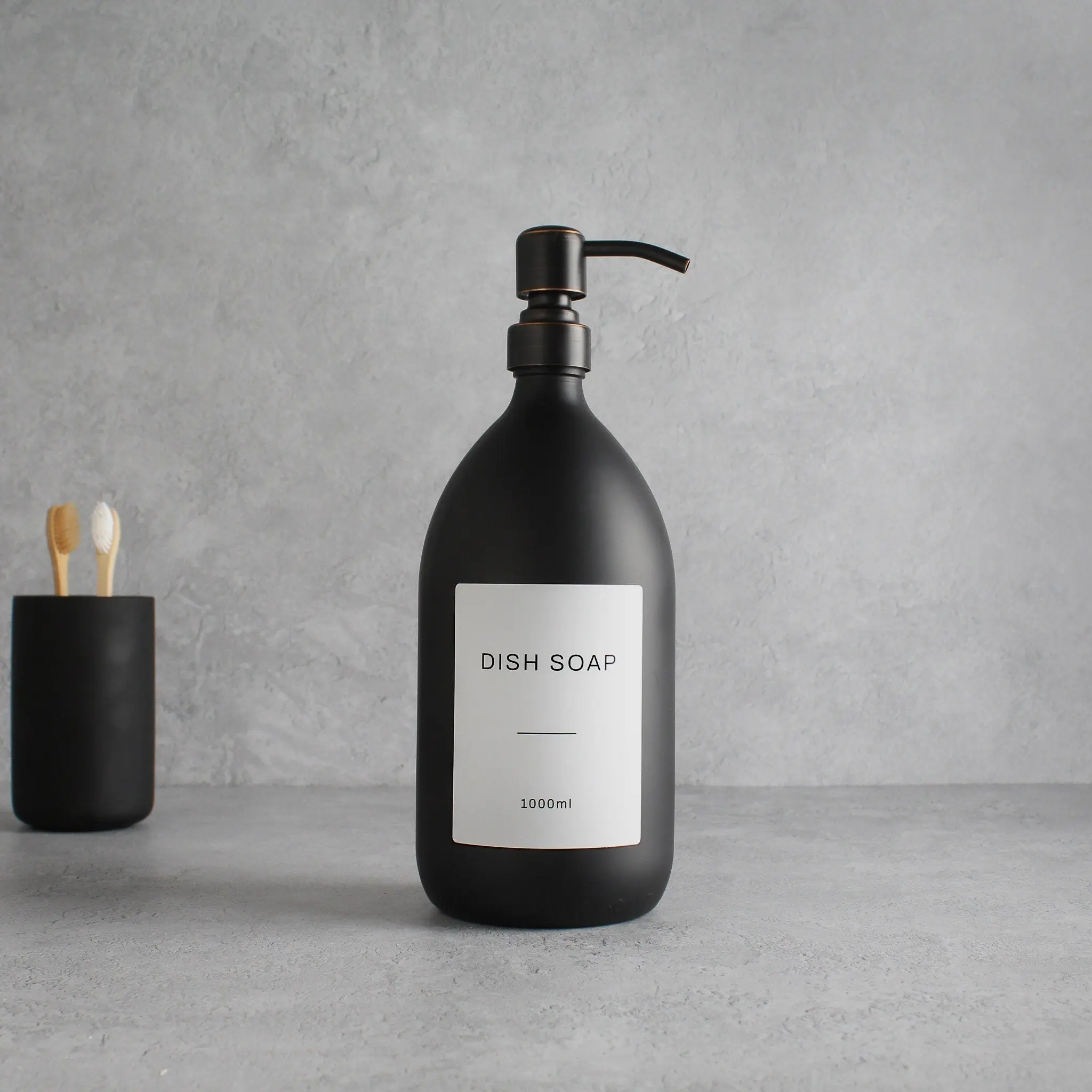 Labelled Matte Black Glass Dispenser Bottle With Black/Copper Pump - Image 3