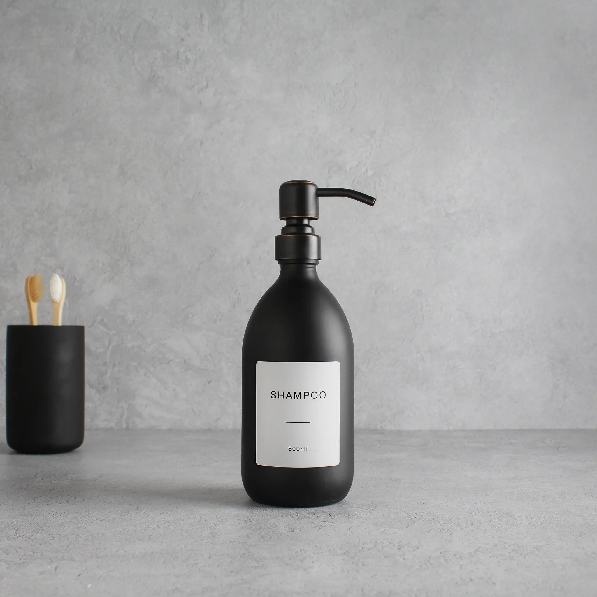 Labelled Matte Black Glass Dispenser Bottle With Black/Copper Pump - Image 4