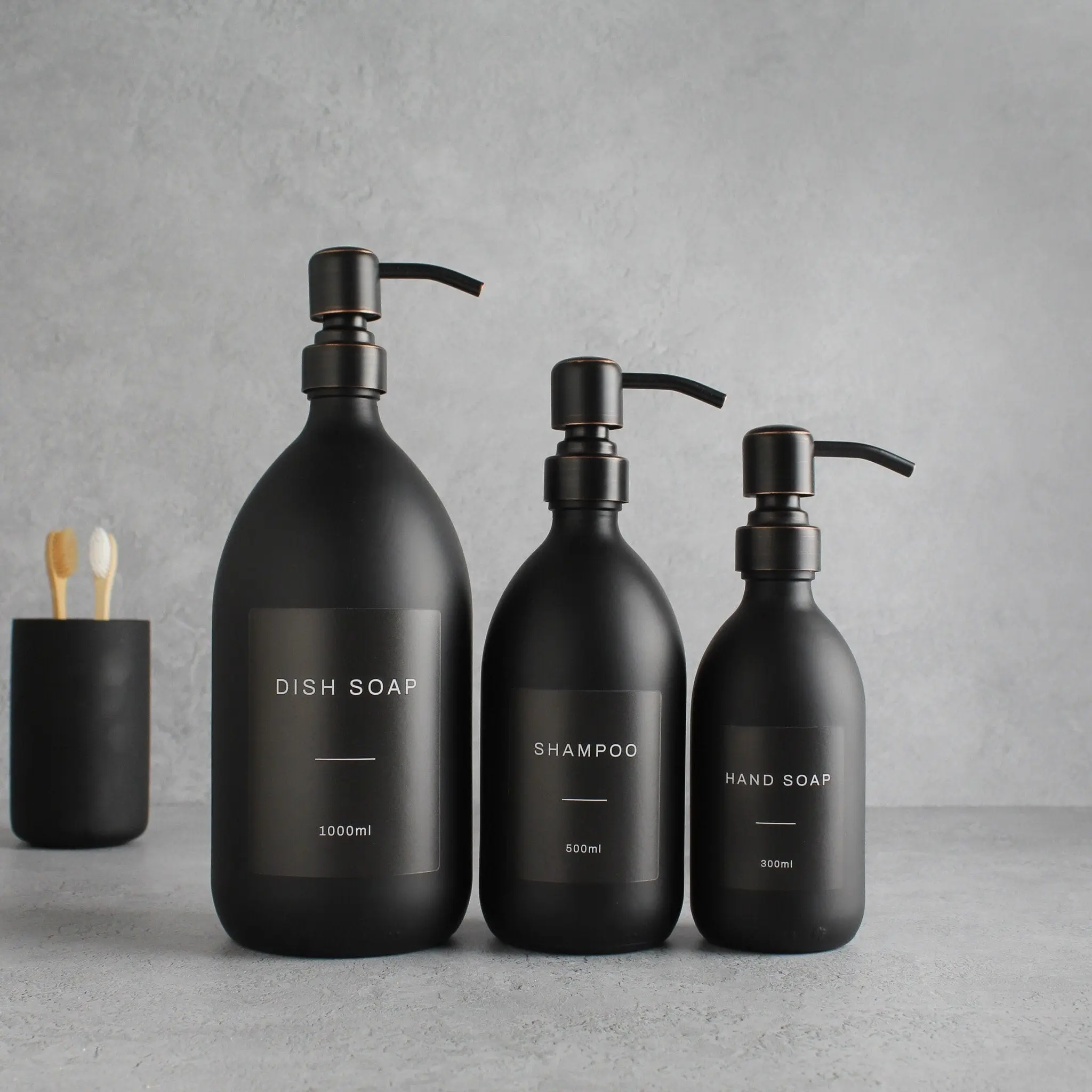 Labelled Matte Black Glass Dispenser Bottle With Black/Copper Pump - Image 2