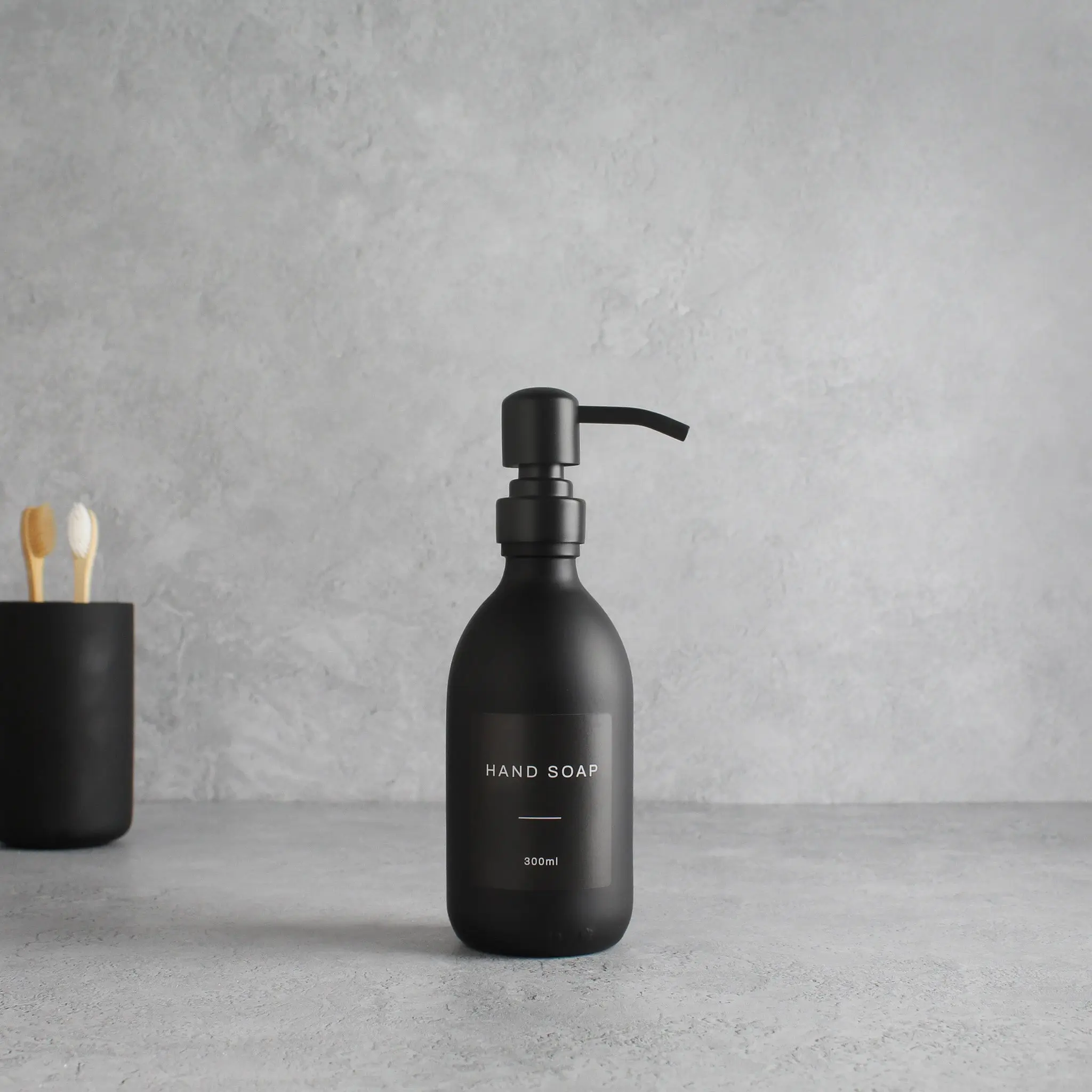 Labelled Matte Black Glass Dispenser Bottle With Matte Black Pump - Image 2