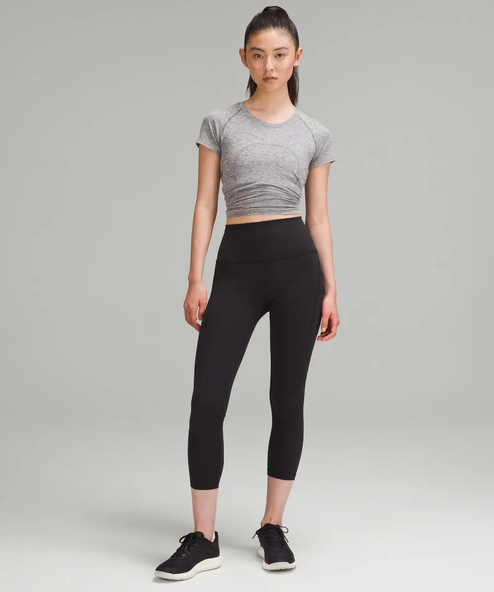 Women's Wunder Train High-Rise Crop Leggings with Pockets - Image 2